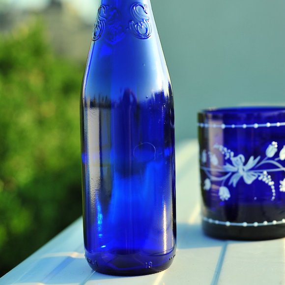 Exquisite Cobalt Blue Water Glass Bottle with Floral 3D Artwork - Picture 11 of 14